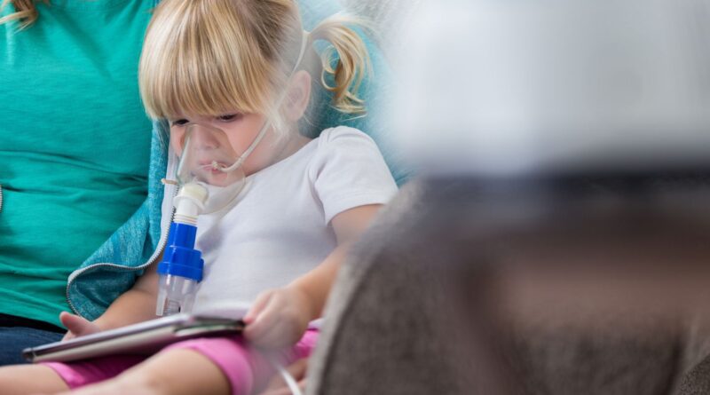 1771974861 sad little girl receives breathing treatment at home 629257184 5a32ec1413f1290037afa476.jpg