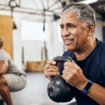 1800ss getty rf mature man doing squats.jpg